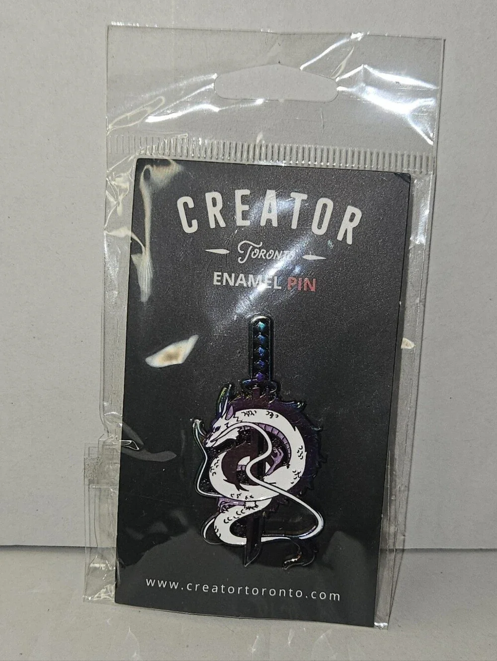 Creator Toronto Enamel Pin, white and purple dragon Around A Katana Sword Blade